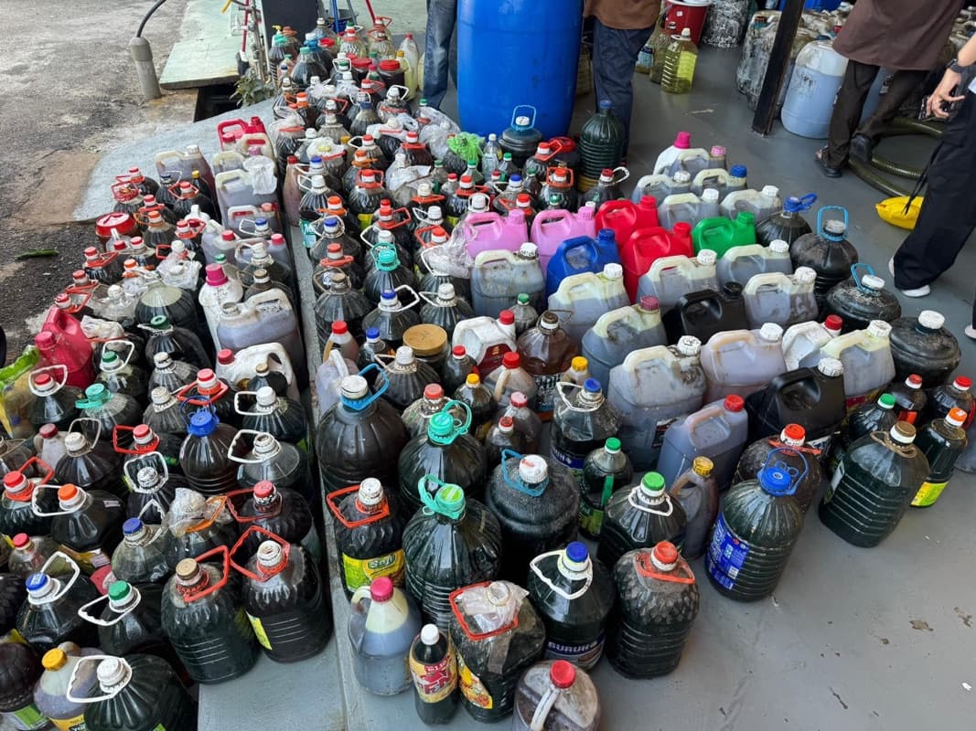 A large pile of used cooking oil bottles and jerry cans received